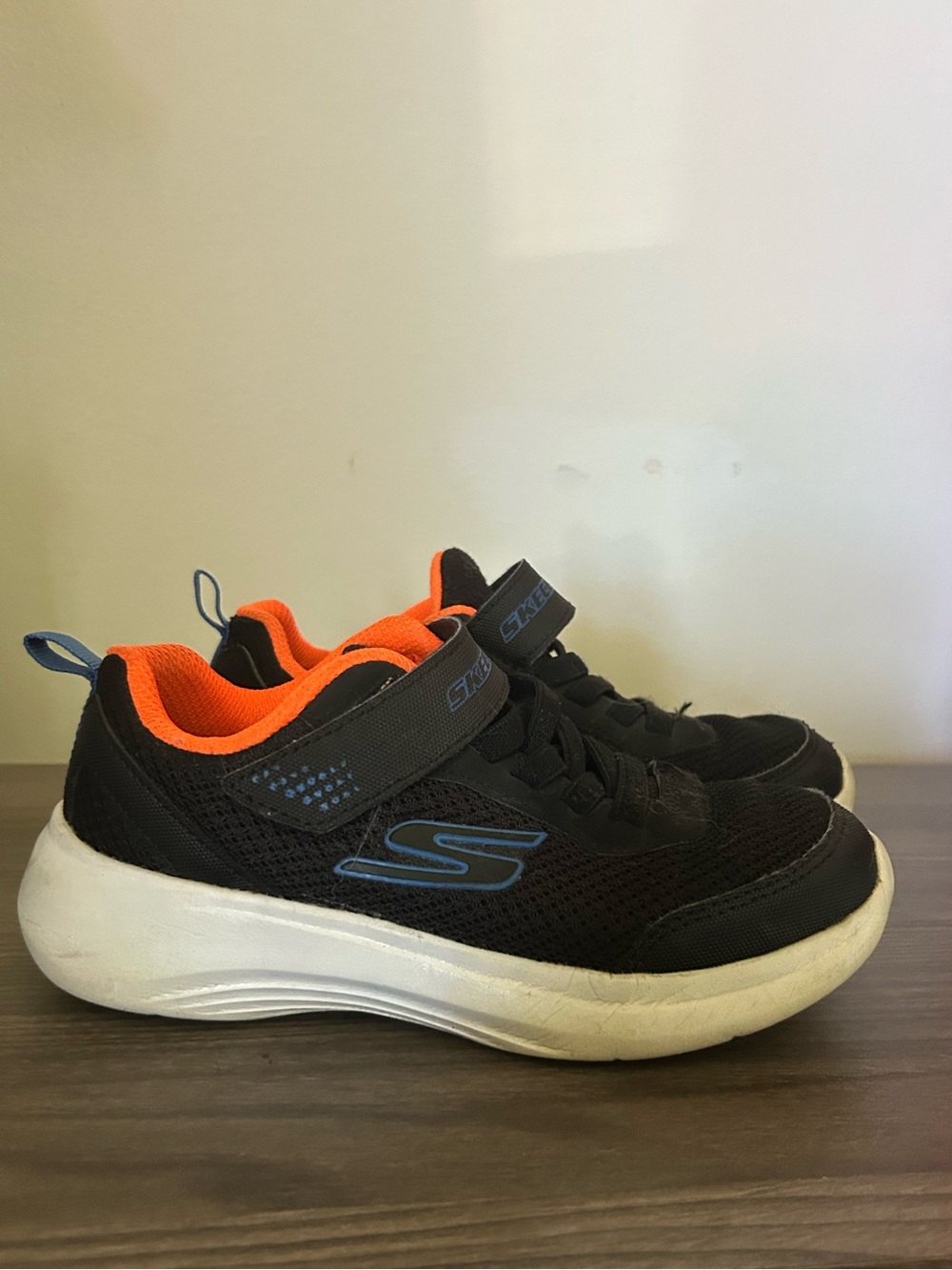 Skechers Kids Black Sneakers with Orange Lining and Blue Accents